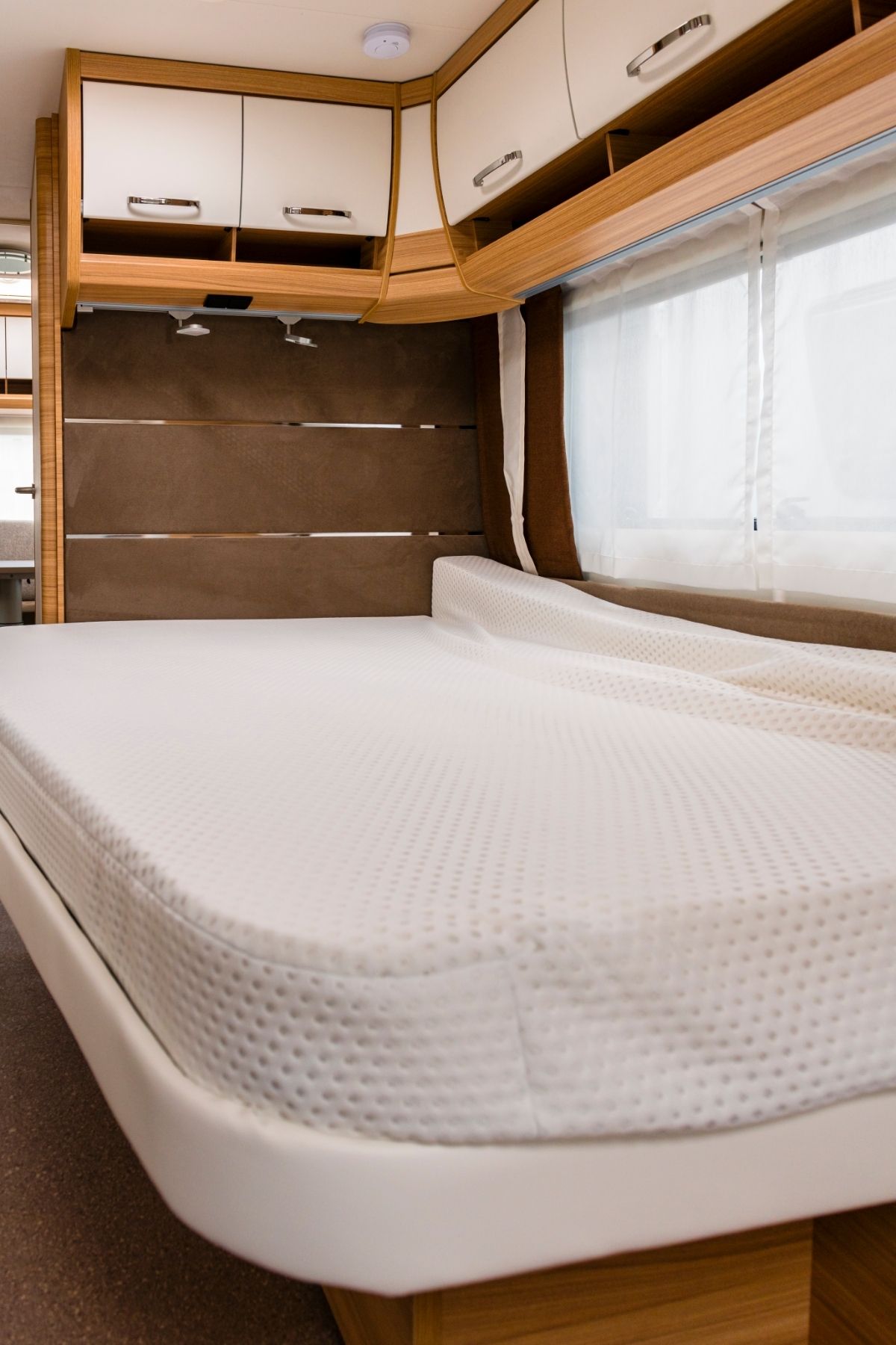 Bed and storage in a camper van