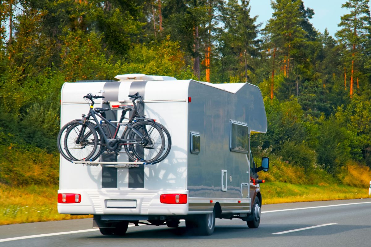 Camper with bicycles on the road